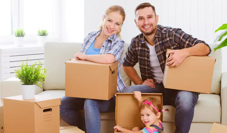 entire family feeling happy after reaching their new house