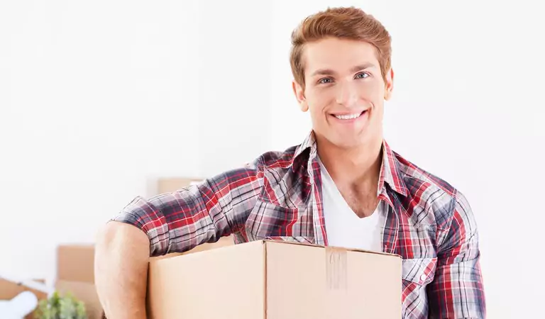 young handsome man with a cardboard box