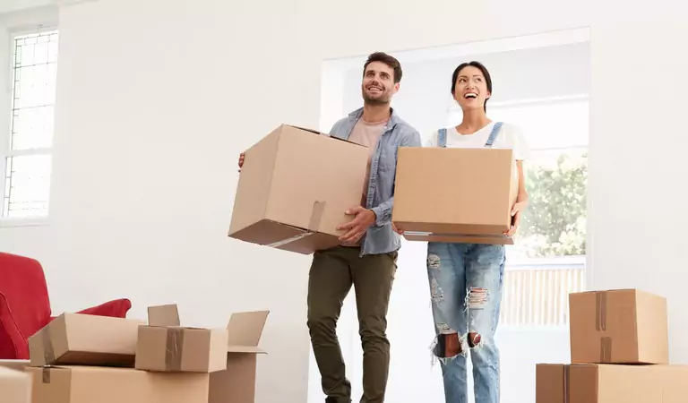 couple just reached at their new house with their stuff