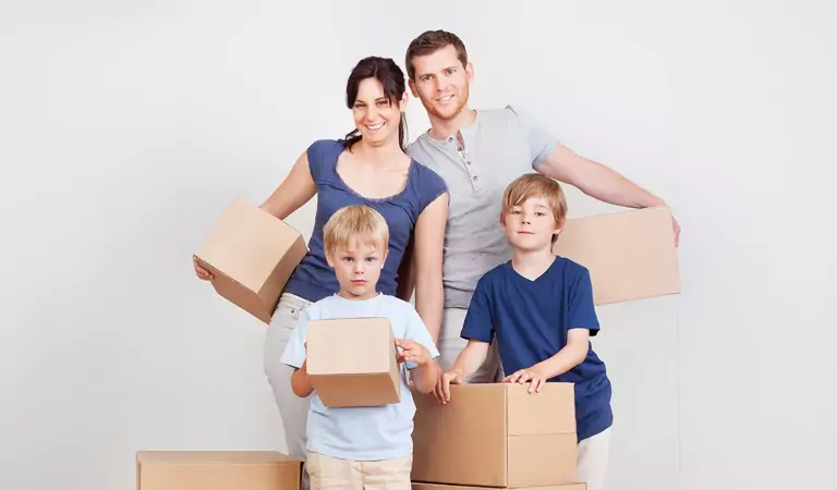 entire family looking happy inside of a house