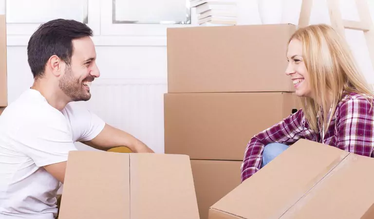 couple looking happy inside of their new house