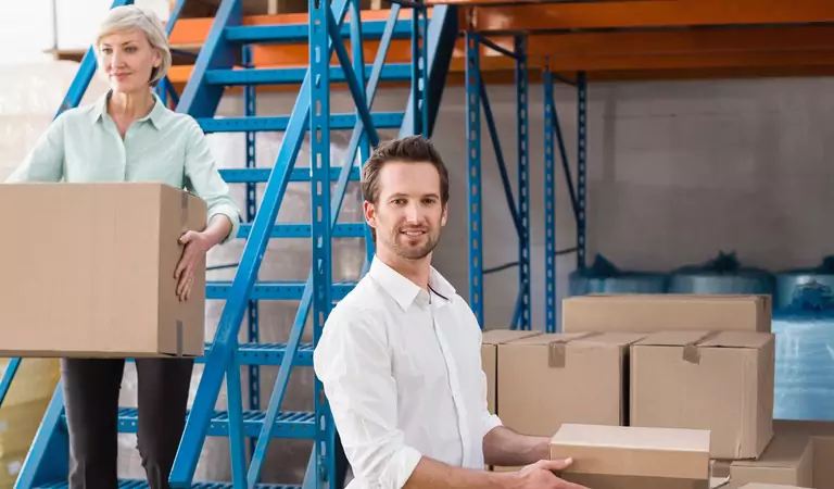 young man and a woman with cardboard boxes