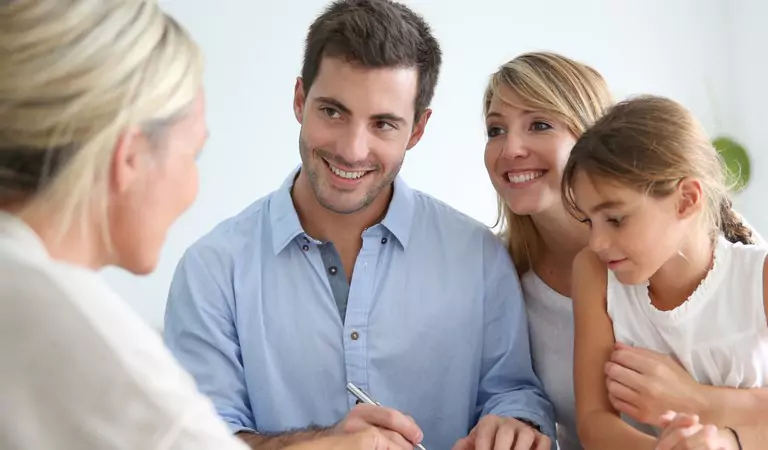 happy family signing their lease agreement