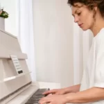 young woman playing a piano