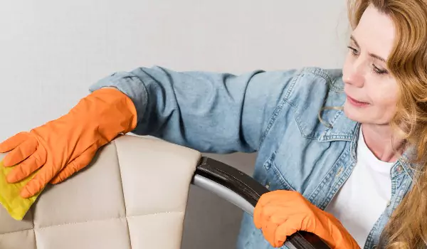 woman cleaning furniture before selling