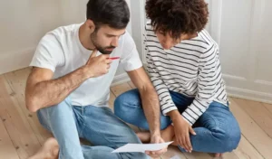 couple planning for something while sitting at their new house