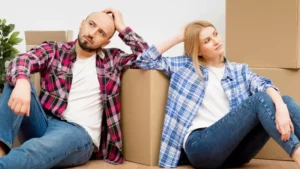 couple looking stressed while moving house
