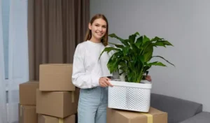 woman holding a plant in her hand