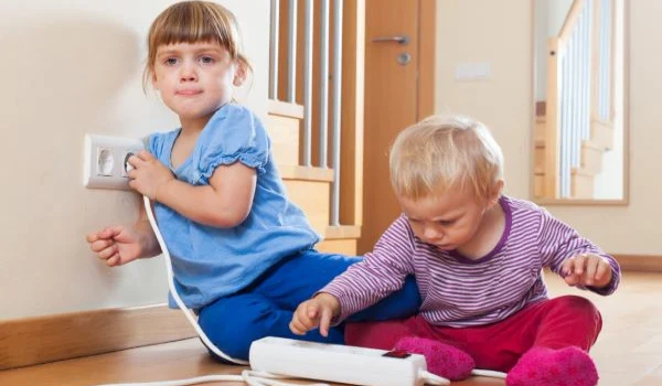 Children with electrical extension and outlet