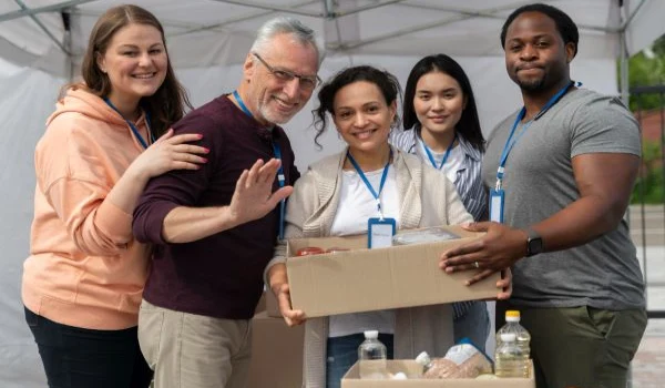 Group of people volunteering at a charity poor people